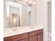 Bright bathroom featuring double sinks, wooden cabinets, and a large mirror at 7206 Forrest Rader Dr, Mint Hill, NC 28227