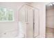 Tiled bathroom featuring a shower and window with natural light at 7206 Forrest Rader Dr, Mint Hill, NC 28227