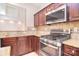 This kitchen has a stainless steel stove, granite countertops, and decorative tile backsplash at 7206 Forrest Rader Dr, Mint Hill, NC 28227