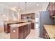 This open-concept kitchen features stainless steel appliances, an island, and granite countertops at 7206 Forrest Rader Dr, Mint Hill, NC 28227