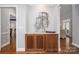 Dry bar featuring custom cabinets, marble countertops, and hardwood floors at 7701 Gold Hill Rd, Rockwell, NC 28138