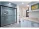 Modern bathroom with a glass-enclosed shower and marble countertop at 7701 Gold Hill Rd, Rockwell, NC 28138