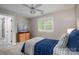 Bedroom with neutral walls, large window, and an ensuite bathroom at 7701 Gold Hill Rd, Rockwell, NC 28138