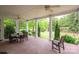 Spacious covered patio with ceiling fans and brick flooring at 7701 Gold Hill Rd, Rockwell, NC 28138