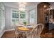 Cozy dining area with natural light, hardwood floors, and seating for four at 7701 Gold Hill Rd, Rockwell, NC 28138