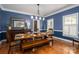 Dining room features hardwood floors, natural light, and seating for six at 7701 Gold Hill Rd, Rockwell, NC 28138