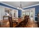 Dining room with hardwood floors, natural light, and seating for six at 7701 Gold Hill Rd, Rockwell, NC 28138