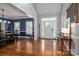 Spacious foyer with gleaming hardwood floors, dining area, and ample natural light, creating a welcoming atmosphere at 7701 Gold Hill Rd, Rockwell, NC 28138