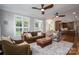 Inviting living room with hardwood floors, ample natural light, and comfortable seating at 7701 Gold Hill Rd, Rockwell, NC 28138