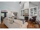 Bright living room featuring a cozy fireplace, built-in shelving, and an open layout, creating an inviting living space at 7701 Gold Hill Rd, Rockwell, NC 28138