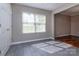 Bright dining area featuring tile flooring, a window letting in natural light, and neutral walls at 8607 Cedardale Ridge Ct, Charlotte, NC 28269