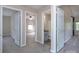 Hallway featuring neutral carpet leading to the bathroom, bedroom, and other rooms in the house at 8607 Cedardale Ridge Ct, Charlotte, NC 28269
