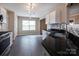 Well-lit kitchen with white cabinets, stainless steel appliances, granite countertops, and tile floors at 8607 Cedardale Ridge Ct, Charlotte, NC 28269