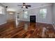 Bright living room with hardwood floors, a cozy fireplace, and sliding door to backyard at 8607 Cedardale Ridge Ct, Charlotte, NC 28269
