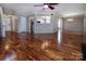 Spacious living room with hardwood floors, large windows, and an open layout at 8607 Cedardale Ridge Ct, Charlotte, NC 28269