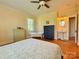 A bright bedroom with hardwood floors, ceiling fan, and separate sinks at 8664 Nc 742 S Hwy, Wadesboro, NC 28170