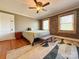 Comfortable bedroom with wood accent wall and large rug at 8664 Nc 742 S Hwy, Wadesboro, NC 28170