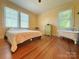 A bright bedroom with hardwood floors and tub at 8664 Nc 742 S Hwy, Wadesboro, NC 28170