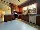 Traditional kitchen with wood cabinets, stainless steel appliances, and ample countertop space at 8664 Nc 742 S Hwy, Wadesboro, NC 28170