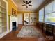 A living room with an ornate fireplace and built-in shelves at 8664 Nc 742 S Hwy, Wadesboro, NC 28170