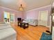 Bright living room with hardwood floors, a fireplace, and access to dining area at 8664 Nc 742 S Hwy, Wadesboro, NC 28170