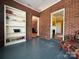 A room with brick walls and shelving showing entryways into other rooms at 8664 Nc 742 S Hwy, Wadesboro, NC 28170