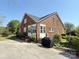 Brick house back exterior with enclosed patio and brick steps at 8664 Nc 742 S Hwy, Wadesboro, NC 28170