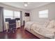 Comfortable bedroom with a work space, hardwood floors, and great natural light at 901 Burnley Rd, Charlotte, NC 28210