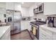 Well-equipped kitchen with stainless steel appliances, ample cabinetry, and stylish countertops at 901 Burnley Rd, Charlotte, NC 28210