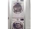 Convenient laundry area with stacked washer and dryer units, maximizing space at 901 Burnley Rd, Charlotte, NC 28210