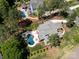 Overhead shot of the backyard with a gorgeous blue in-ground pool, patio area, and lush landscaping at 101 Cross Current Ln # 137, Belmont, NC 28012