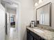 Powder room featuring granite countertops, undermount sink, and decorative mirror, offering style and functionality at 101 Cross Current Ln # 137, Belmont, NC 28012