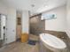 Spacious bathroom with a soaking tub, walk-in shower, and built in storage at 101 Cross Current Ln # 137, Belmont, NC 28012