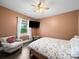 Comfortable bedroom with a ceiling fan, neutral color scheme, and large window offering natural light at 101 Cross Current Ln # 137, Belmont, NC 28012