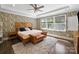 Primary bedroom featuring eye catching wallpaper, hardwood floors, and plenty of natural light at 101 Cross Current Ln # 137, Belmont, NC 28012