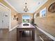 Bonus room featuring wood-paneled accent wall, hardwood floors, and ample natural light at 101 Cross Current Ln # 137, Belmont, NC 28012