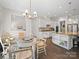 Bright breakfast nook situated beside the kitchen, featuring a chandelier and lots of natural light at 101 Cross Current Ln # 137, Belmont, NC 28012