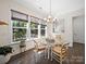Cozy breakfast nook featuring lots of natural light from the backyard, and a chandelier at 101 Cross Current Ln # 137, Belmont, NC 28012