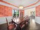 Elegant dining room with wood floors, colorful wallpaper, and a large wood table ready for entertaining at 101 Cross Current Ln # 137, Belmont, NC 28012