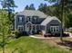 Charming two-story home featuring a landscaped yard, inviting porch, and classic architectural details at 101 Cross Current Ln # 137, Belmont, NC 28012