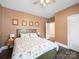 Serene main bedroom with a ceiling fan, bedside lamps, and a calm ambiance, perfect for relaxation and rest at 101 Cross Current Ln # 137, Belmont, NC 28012