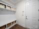 Organized mudroom featuring storage bins, hooks, and a bench for functionality and convenience at 101 Cross Current Ln # 137, Belmont, NC 28012