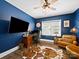 Home office with blue walls, hardwood floors, a cowhide rug, and a window for natural light at 101 Cross Current Ln # 137, Belmont, NC 28012