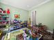 Bright playroom with lots of toys, neutral walls, and hardwood floors. A perfect space for fun and imagination at 101 Cross Current Ln # 137, Belmont, NC 28012