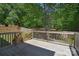 Backyard deck with a view of a fenced-in yard and mature trees at 1021 Vickie Ln, Matthews, NC 28104