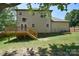 Well-maintained backyard with a wooden deck and staircase, perfect for outdoor relaxation and entertainment at 1021 Vickie Ln, Matthews, NC 28104