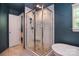 Luxurious walk-in shower with white tile and river rock floor, plus freestanding tub at 1021 Vickie Ln, Matthews, NC 28104