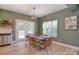 A dining room featuring a table set for four with a modern chandelier above at 1021 Vickie Ln, Matthews, NC 28104