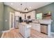 A well-lit kitchen with white cabinetry, stainless steel appliances, and granite countertops at 1021 Vickie Ln, Matthews, NC 28104