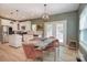 Dining table in kitchen adjacent to a white kitchen and stainless steel appliances at 1021 Vickie Ln, Matthews, NC 28104